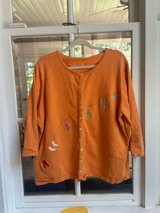 orange clothesline sweater
