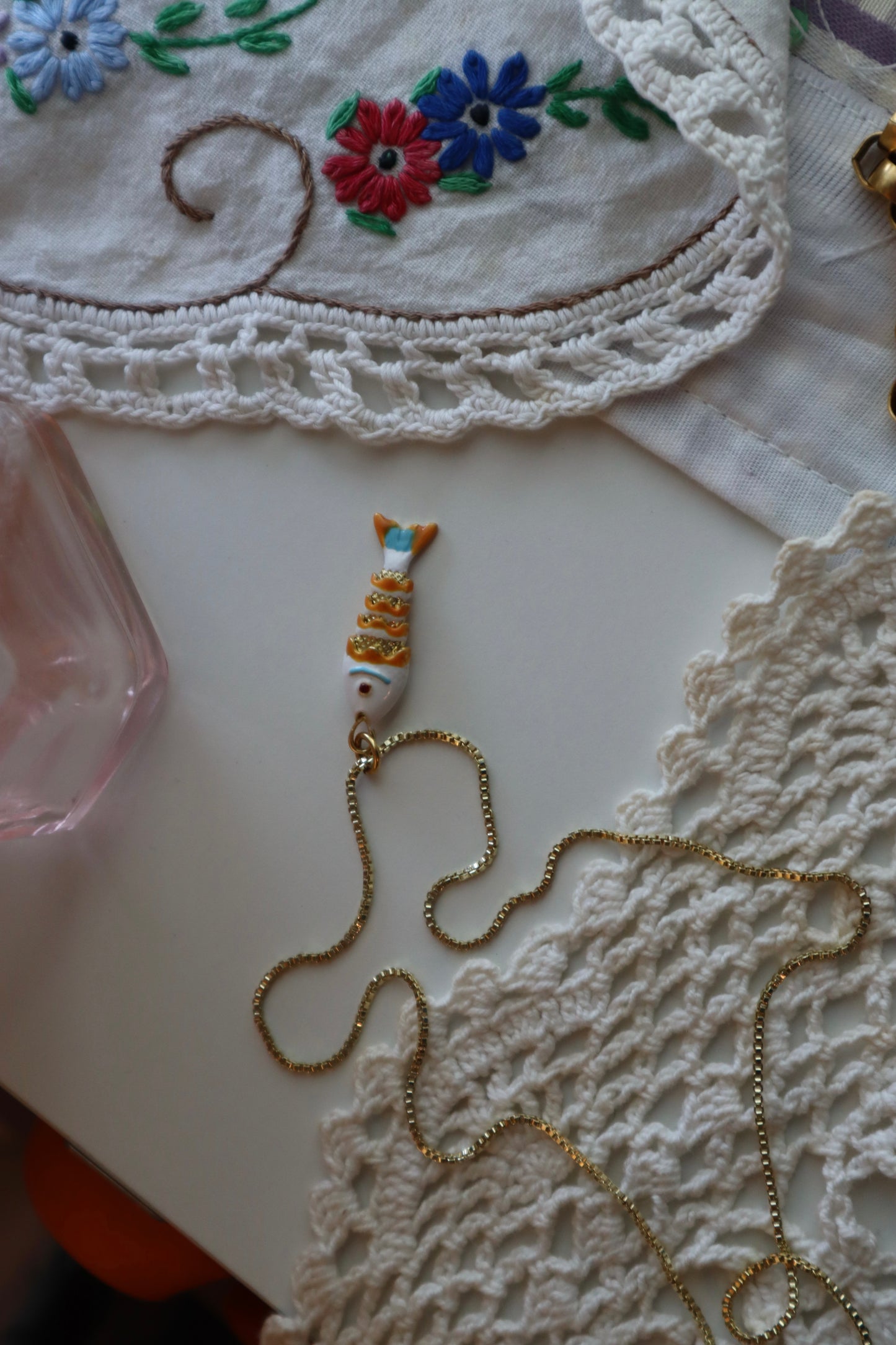 orange + white fish charm