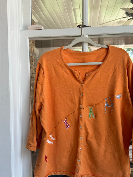 orange clothesline sweater