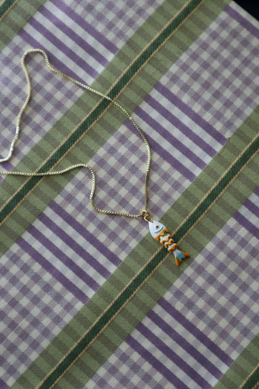 orange + white fish charm